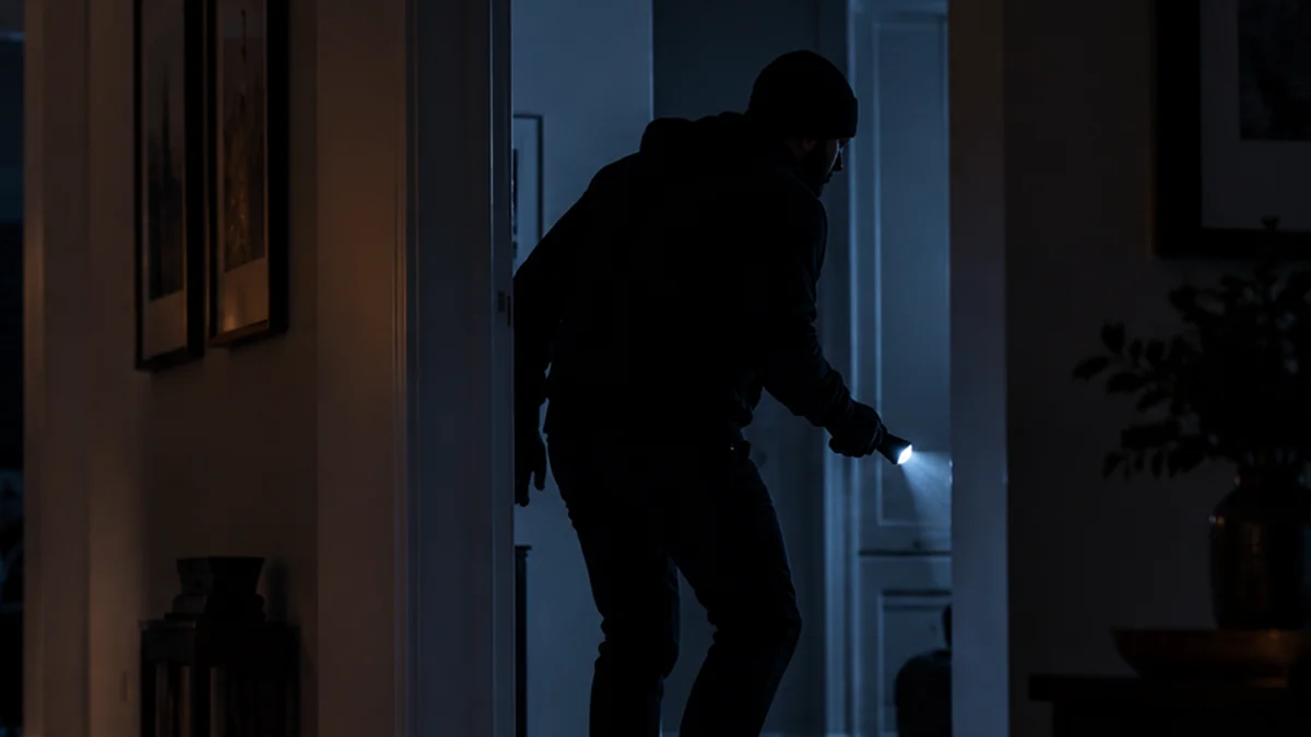Intruder attempting to force open a residential door